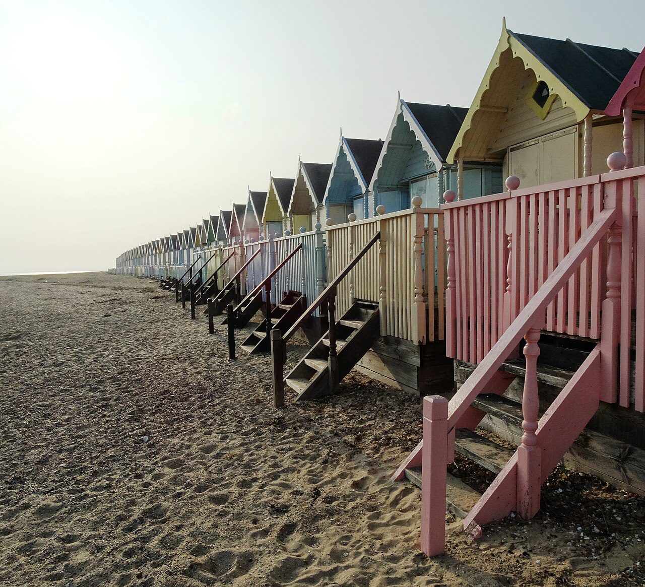 essex coast walks - Beach huts on Mersea Island - looking west